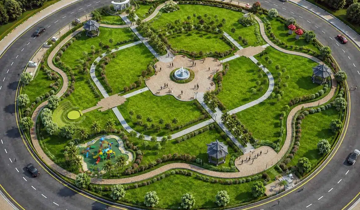 Aerial view of circular community park with fountain, walkways, gazebos, and surrounding road