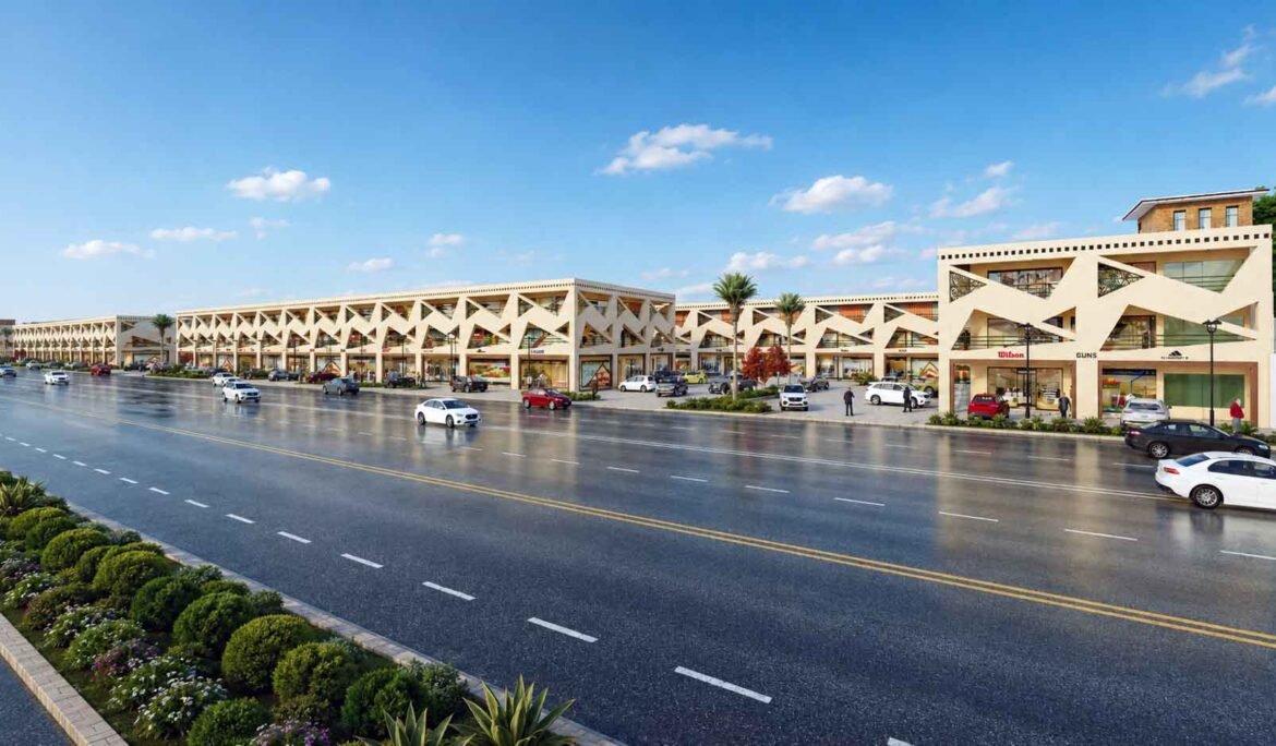 Commercial building exterior view from main road with parked vehicles