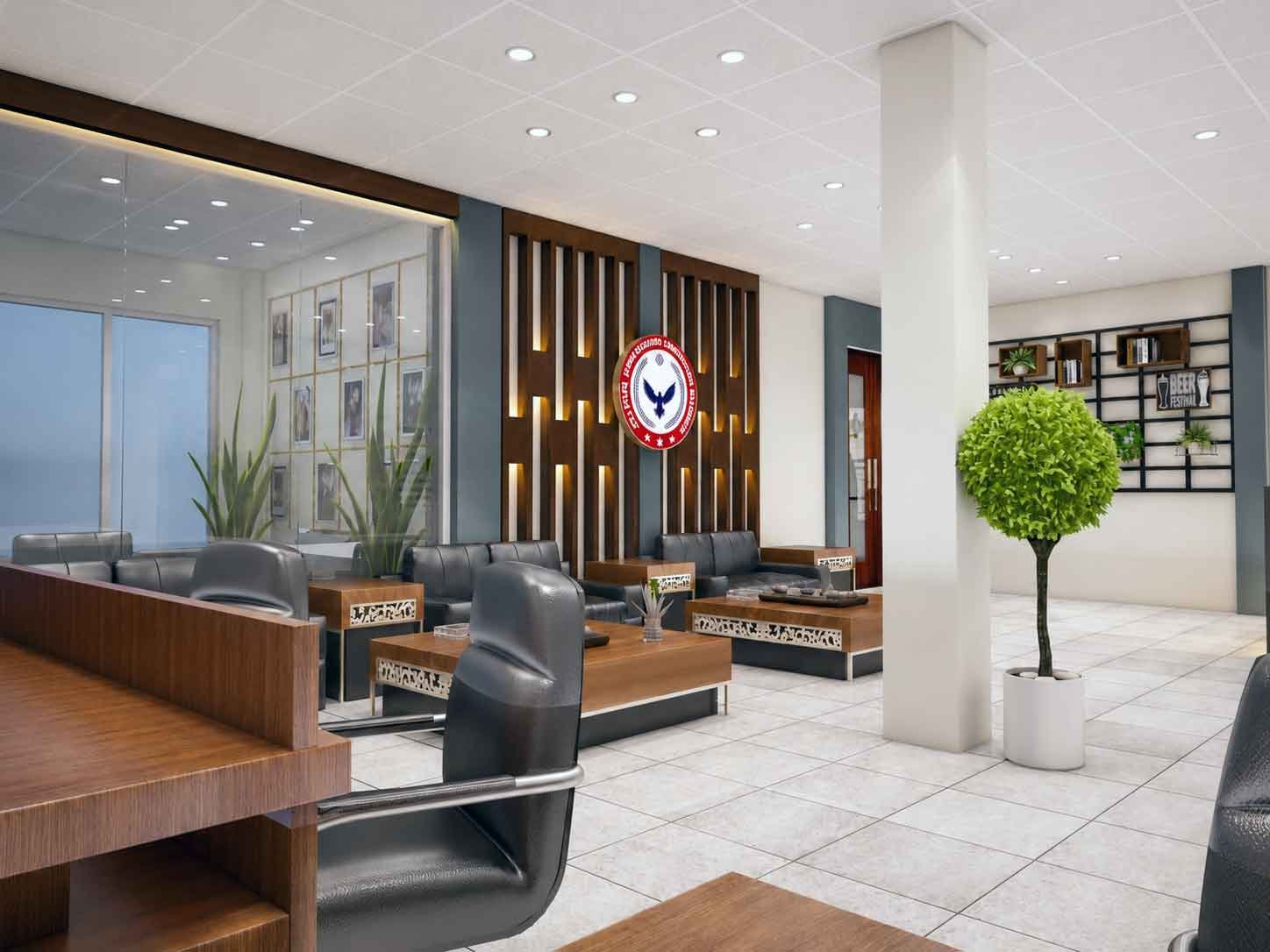 Corporate lounge seating area with black leather sofas and wooden decorative wall panel