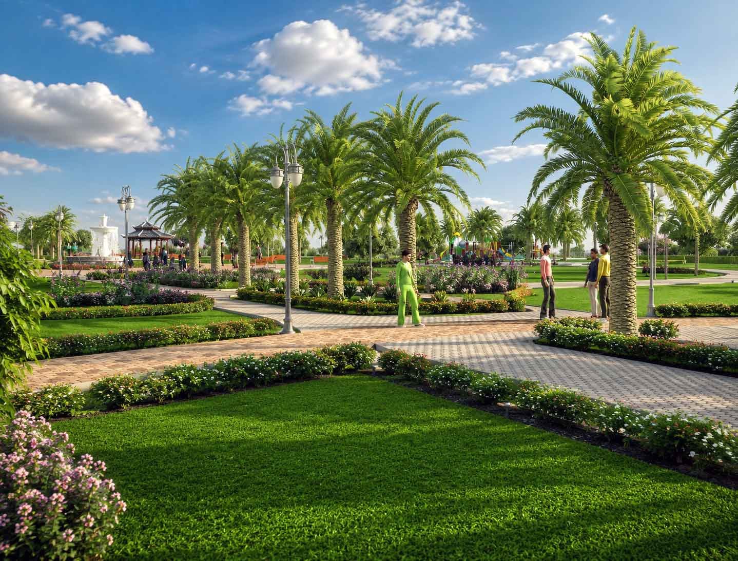 Garden pathway lined with tall palm trees, flower beds, and manicured lawns