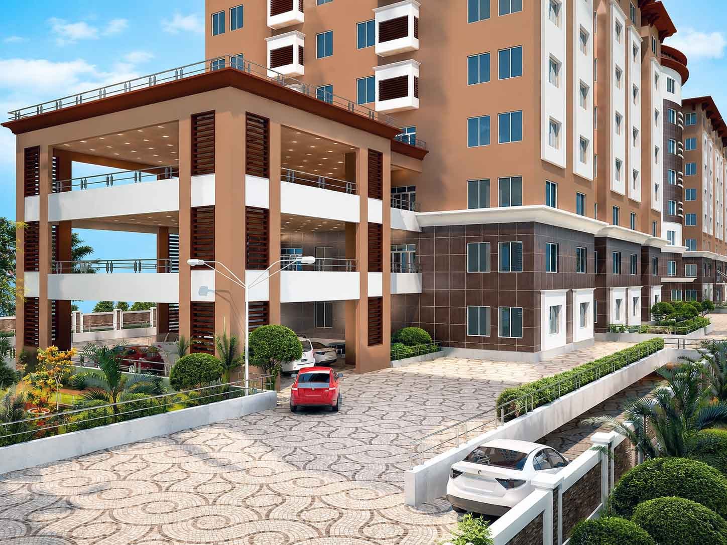 Multi-story apartment building exterior with covered entrance driveway and landscaped courtyard